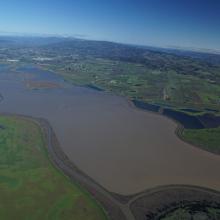 Aerial photograph taken during March 2019, when levees broke at Camp 4 Ranch and throughout the Sonoma Creek Baylands, causing widespread flooding. Levee breaks and flooding are typical under storm conditions in this region.  